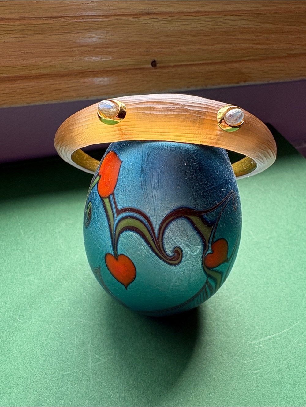 Alexis Bittar tapered bangle with 2 labradorite stones bezel set in gold.